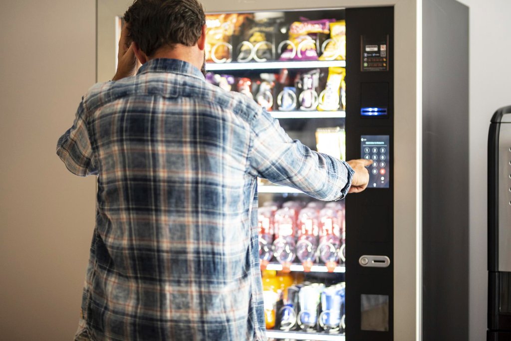 Vending machine success story UK showing a row of well-maintained vending machines in different commercial locations representing a profitable route