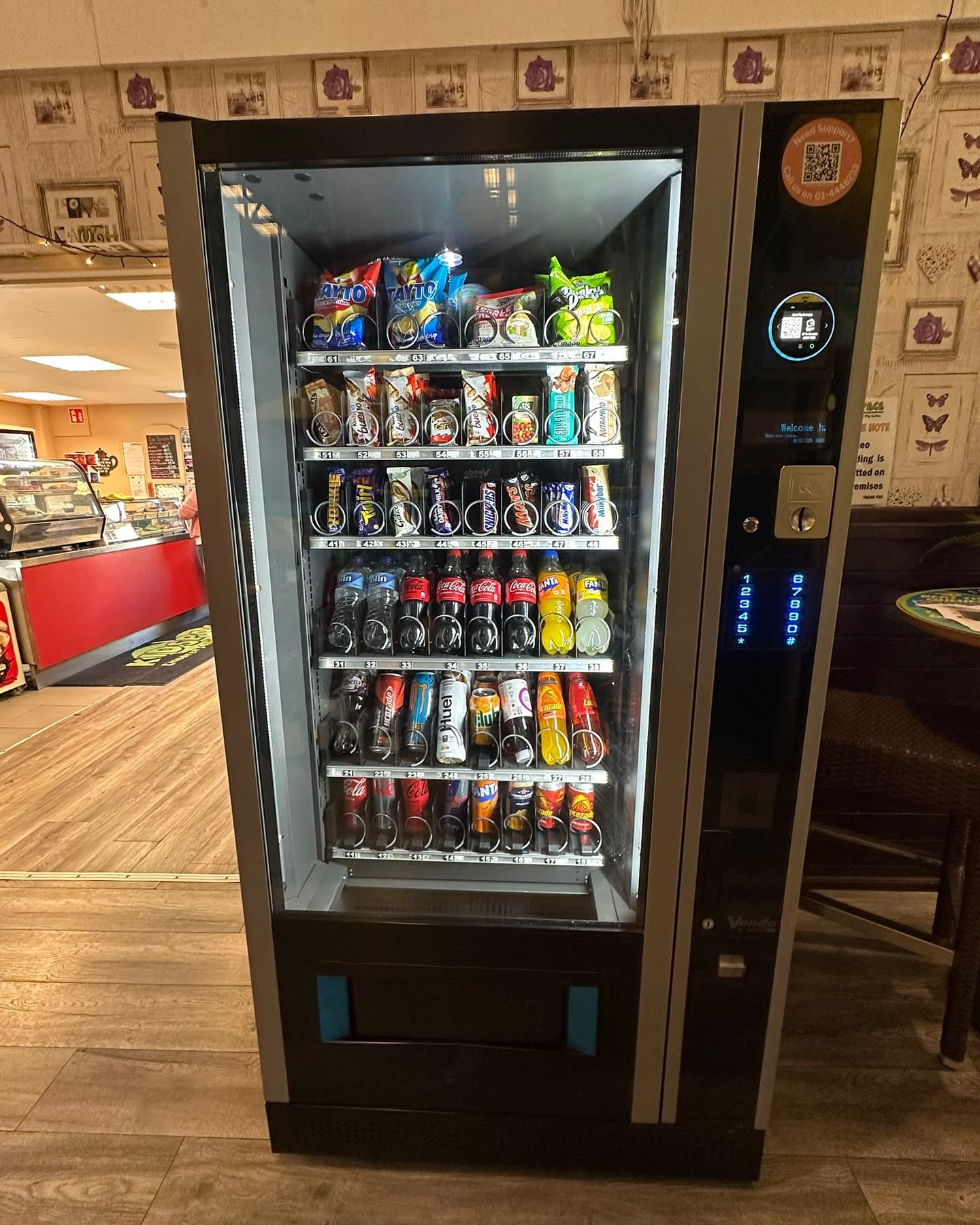 How much do vending machines make UK showing an Irelley combo vending machine stocked with snacks and drinks ready to earn