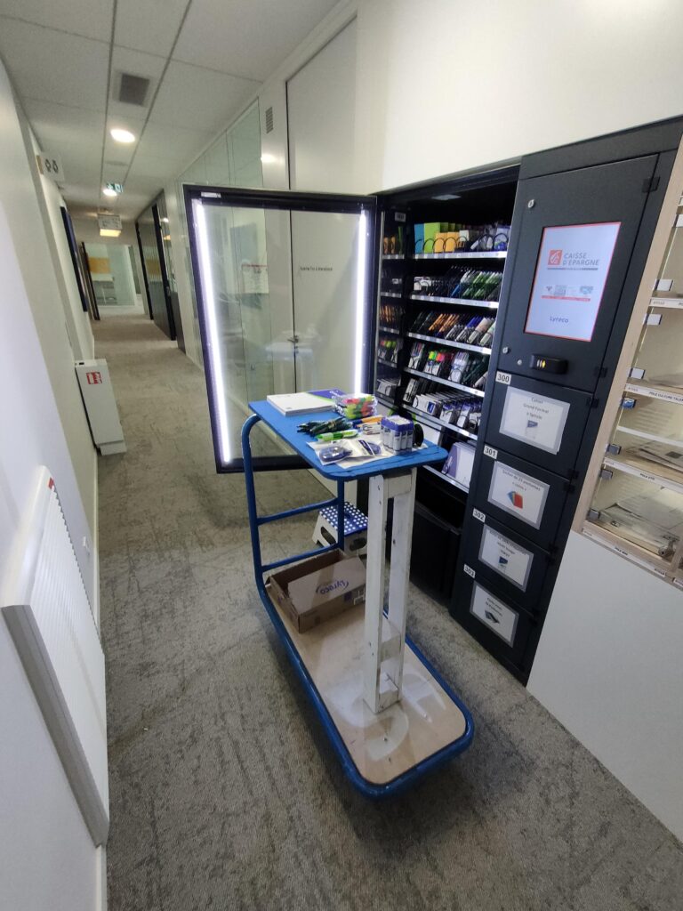 Restock a vending machine efficiently showing an operator loading products into a vending machine with organised stock crates and a route plan