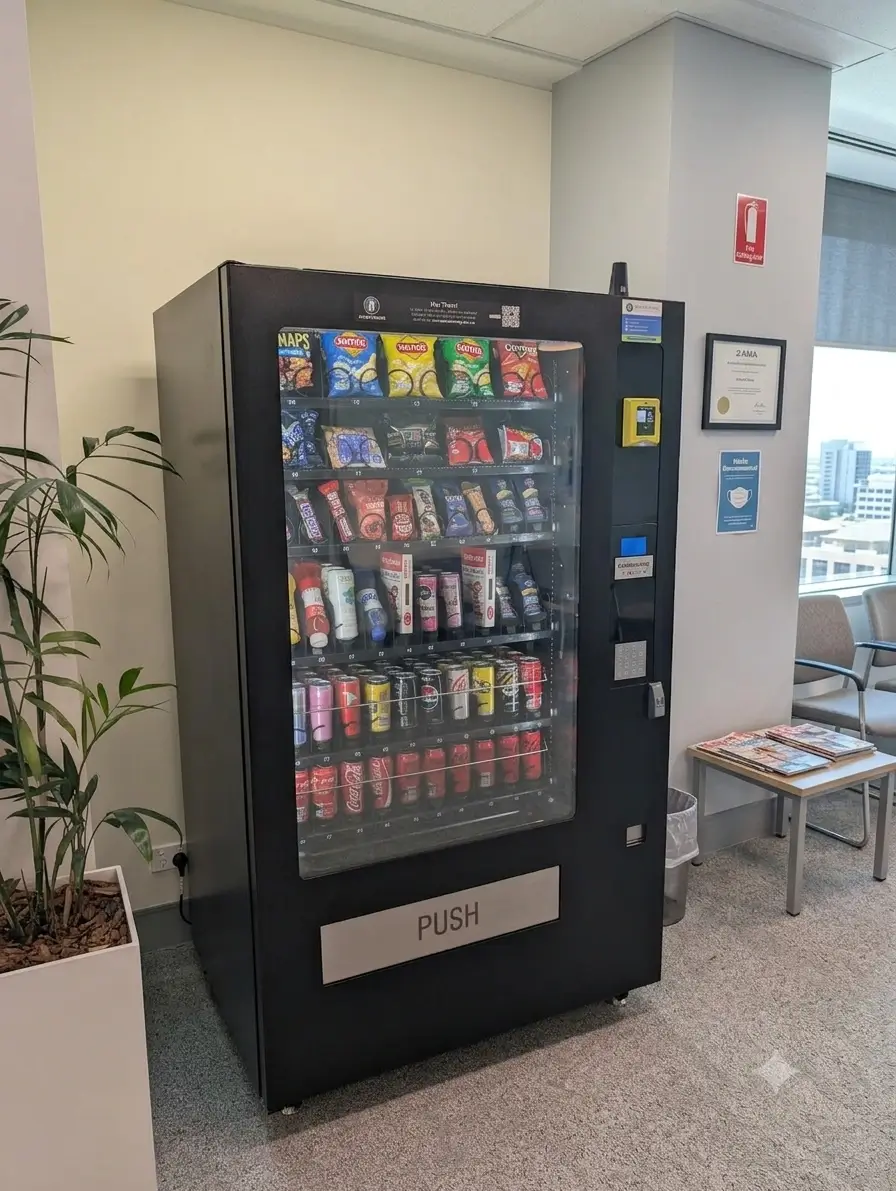 Combo vending machine with snacks and chilled drinks in a UK break room