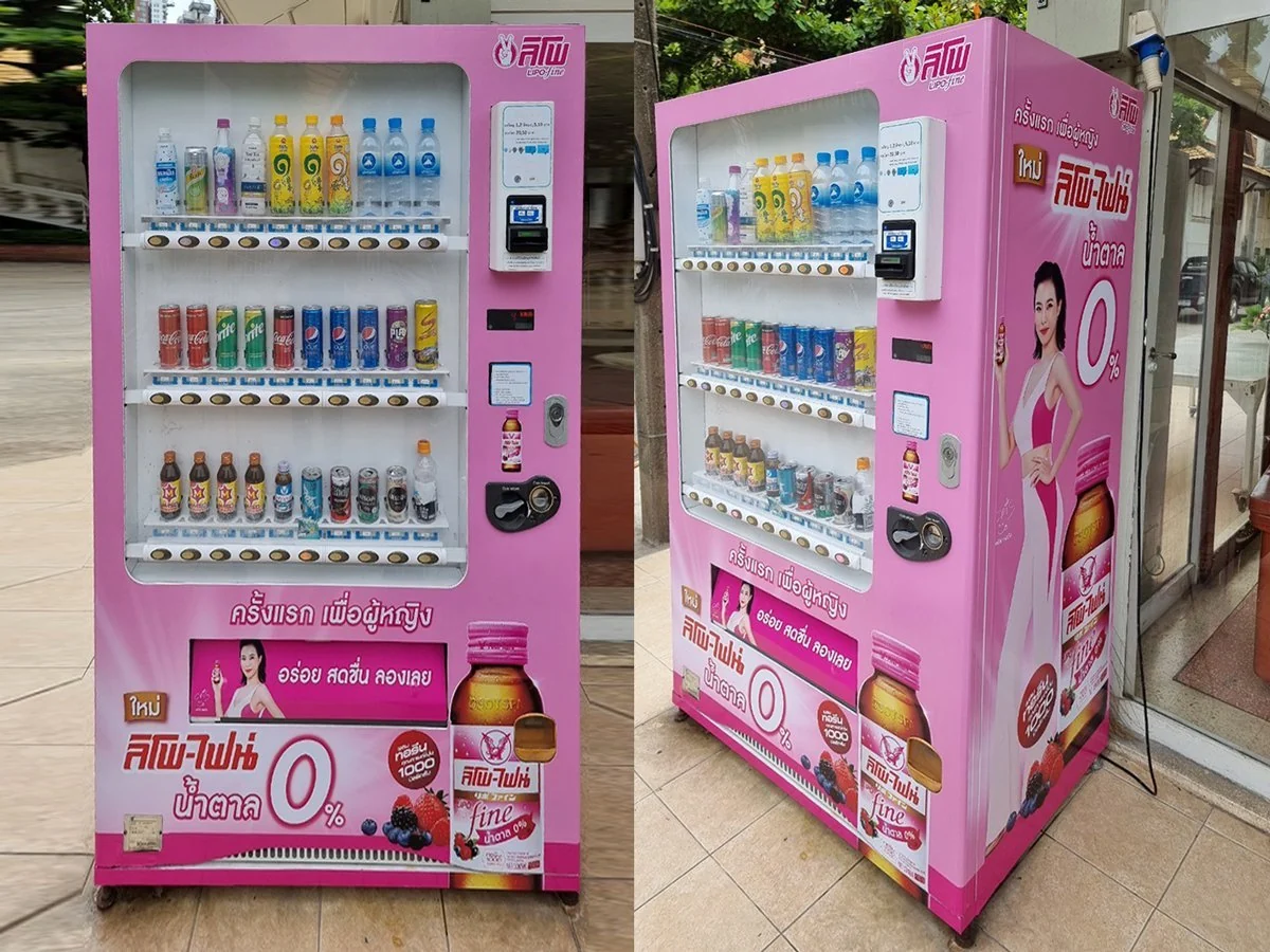 Custom vending machine wrap in bold brand colours on a UK snack machine