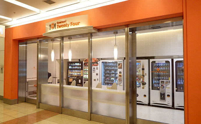 Airport vending machines with travel essentials at a UK departure gate