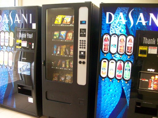 Vending machines for hotels in a UK hotel lobby near the lifts