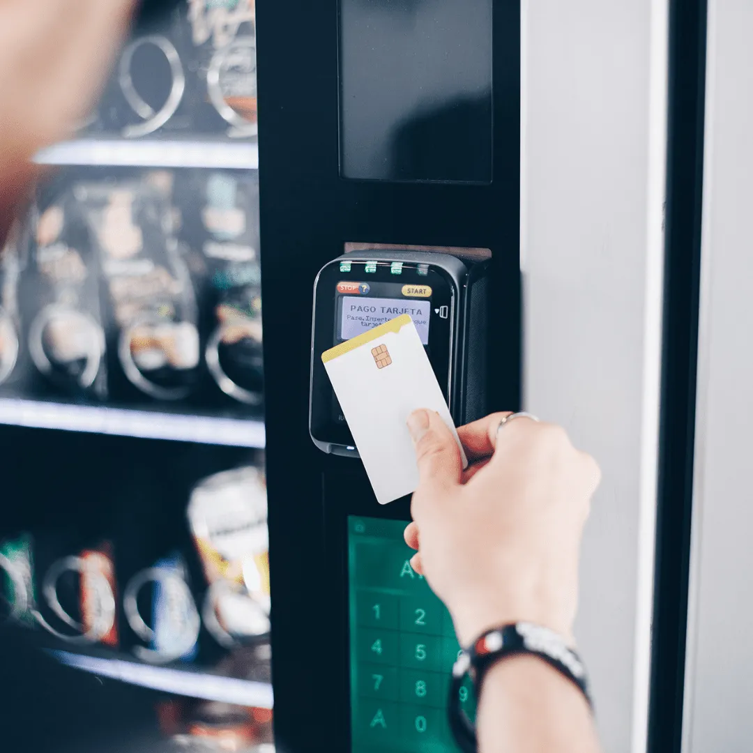 Contactless vending machine with a card reader accepting Apple Pay at a UK office